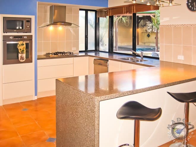 Kitchen renovation opening onto an alfresco pool area, Mindarie job